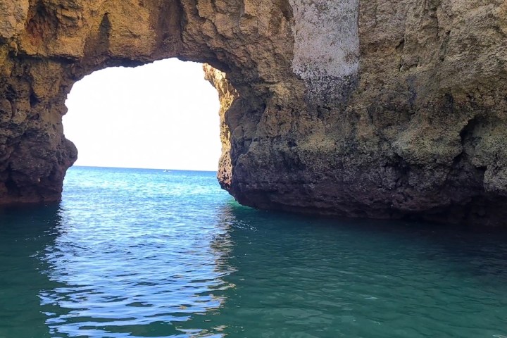 a rock formation on a body of water