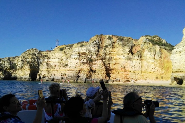 a group of people on a boat in a body of water