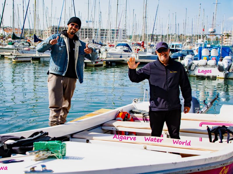 a group of people on a boat in the water