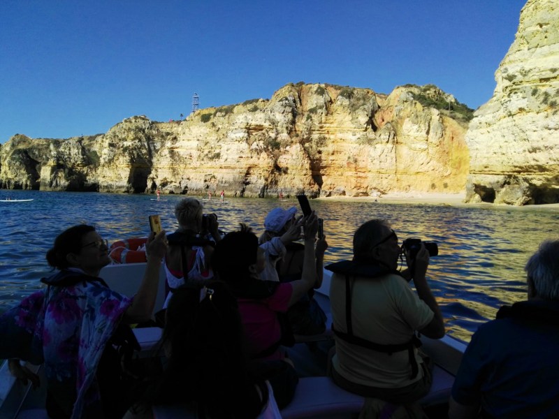 a group of people riding on a boat in a body of water